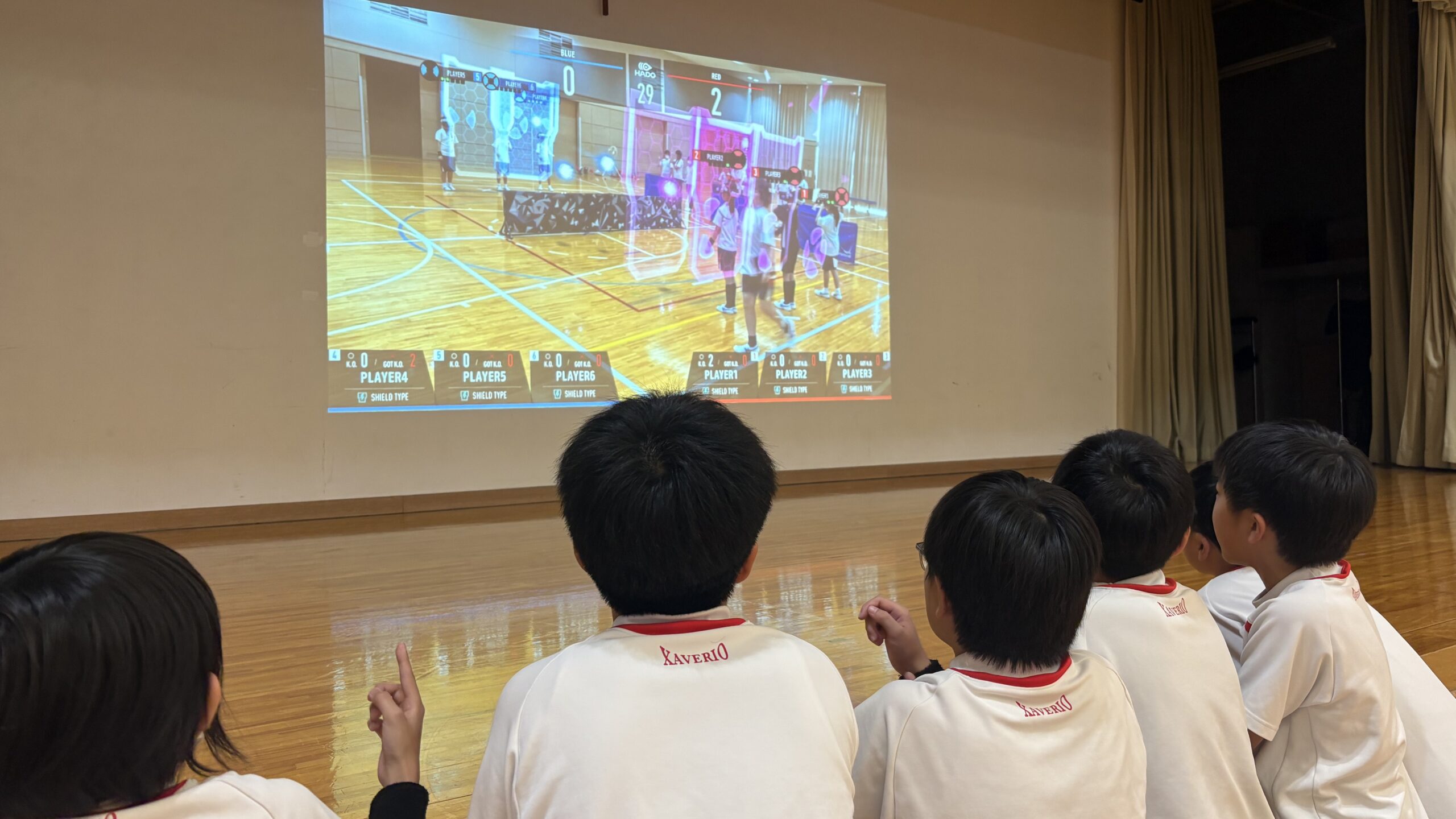 Students playing HADO in a school program