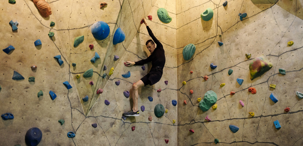 Guests enjoying an indoor climbing attraction