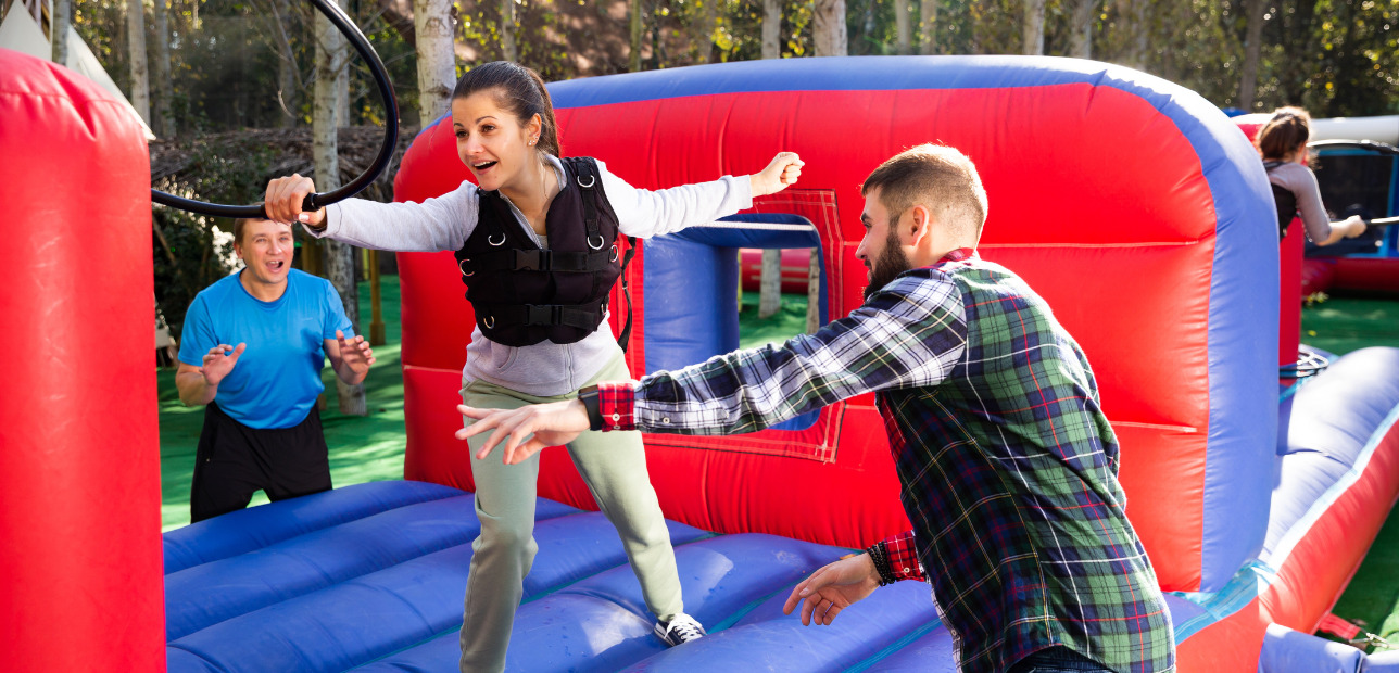 Guests competing in a physical obstacle challenge